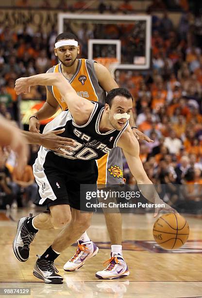 Manu Ginobili of the San Antonio Spurs controls the ball past Jared Dudley of the Phoenix Suns during Game Two of the Western Conference Semifinals...