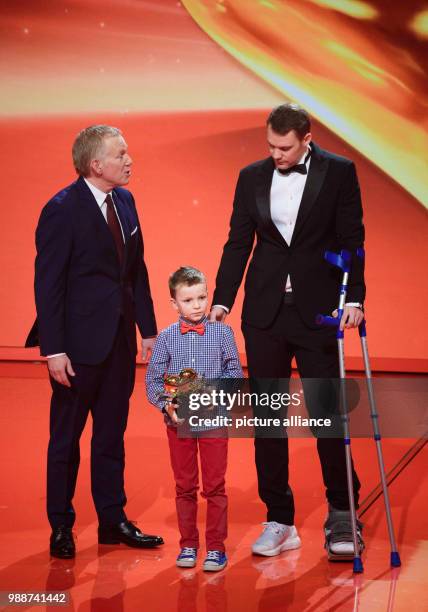 Frederik awarding soccer player Manuel Neuer from FC Bayern Munich with the Golden Heart during the charity gala "A heart for children" in Berlin,...