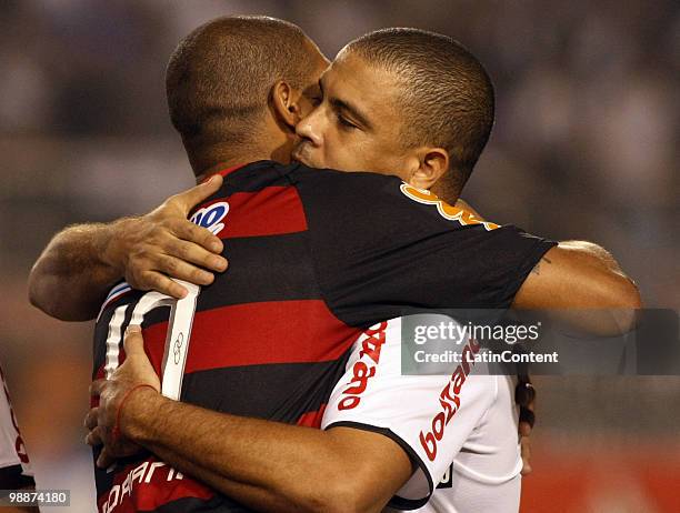 Adriano of Flamengo embraces Ronaldo Nazario of Corinthians prior to their Libertadores Cup match at Pacaembu stadium on May 5, 2010 in Sao Paulo,...
