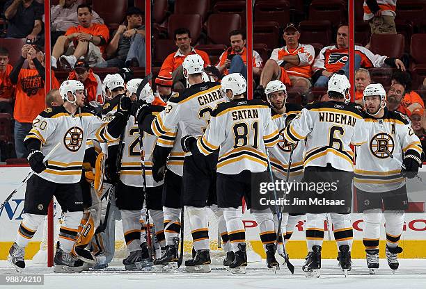 The Boston Bruins celebrate after defeating the Philadelphia Flyers in Game Three of the Eastern Conference Semifinals during the 2010 NHL Stanley...