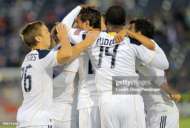 Alan Gordon of the Los Angeles Galaxy is congratulated by his teammates after his goal against the Colorado Rapids in the 21st minute to give the...