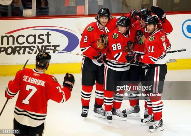 Brent Seabrook, Duncan Keith, Patrick Kane, Jonathan Toews and John Madden of the Chicago Blackhawks celebrate a goal against the Vancouver Canucks...