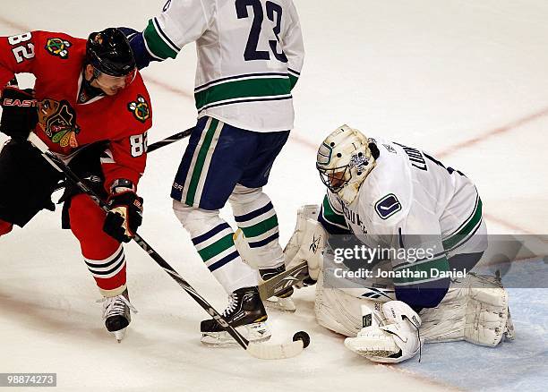 Roberto Luongo of the Vancouver Canucks stops a shot by Tomas Kopecky of the Chicago Blackhawks in Game Two of the Western Conference Semifinals...