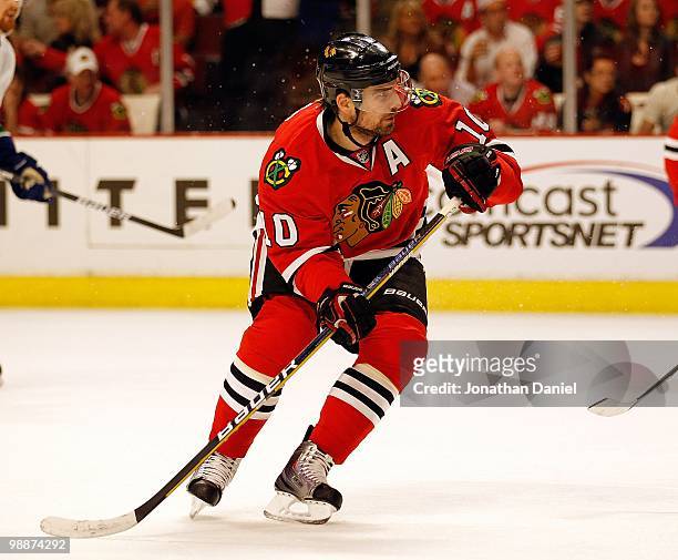 Patrick Sharp of the Chicago Blackhawks chases down the puck against the Vancouver Canucks in Game Two of the Western Conference Semifinals during...