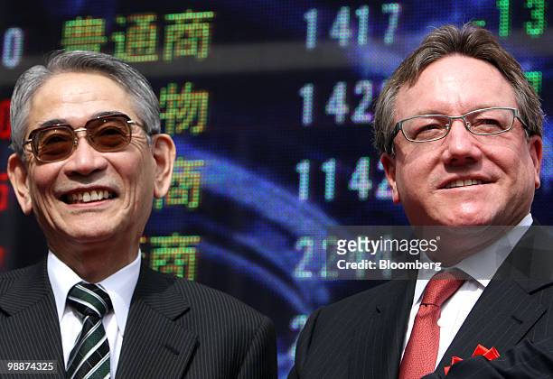 Fumiyuki Akikusa, president and chief executive officer of Mitsubishi UFJ Morgan Stanley Securities Co., left, and Jonathan Kindred, president and...