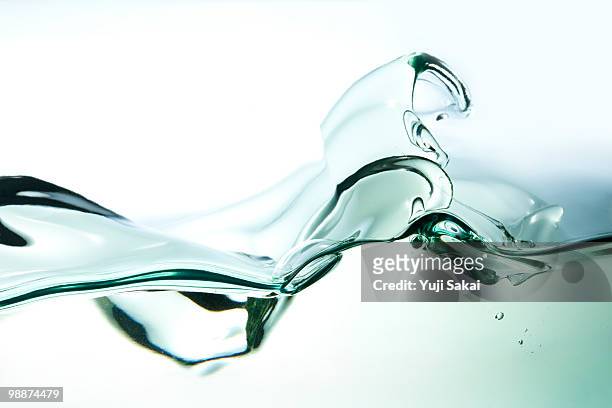 moving oil side view - oil splashing stock pictures, royalty-free photos & images