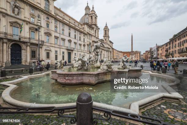 view of piazza navona with fountain of the four rivers and the egyptian obelisk in the middle, rome, lazio, italy, europe - fountain of the four rivers stock pictures, royalty-free photos & images