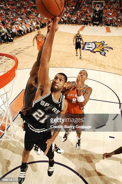 Tim Duncan of the San Antonio Spurs drives for a shot against Amare Stoudemire of the Phoenix Suns in Game Two of the Western Conference Semifinals...