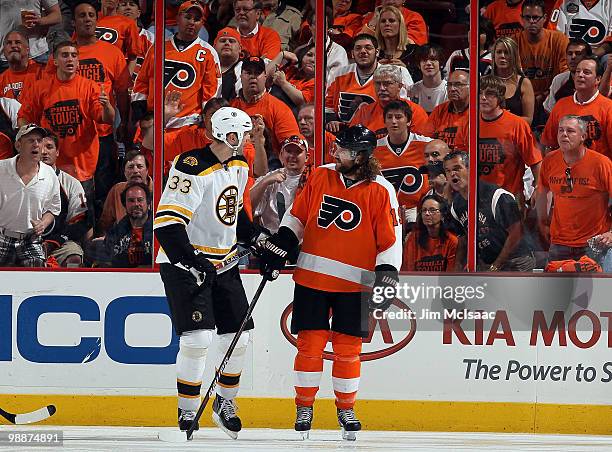 Scott Hartnell of the Philadelphia Flyers has some words with Zdeno Chara of the Boston Bruins in Game Three of the Eastern Conference Semifinals...