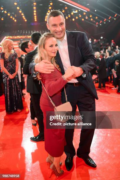 Former professional boxers, Regina Halmich and Vitali Klitschko standing together for a picture after the charity gala "A heart for children" in...