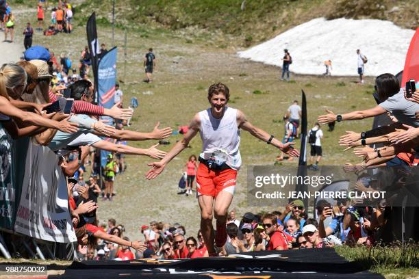 Swiss orienteering competitor and runner Marc Lauenscein crosses the finish line during the 16th edition of the Marathon of Mont-Blanc, on July 1 in...