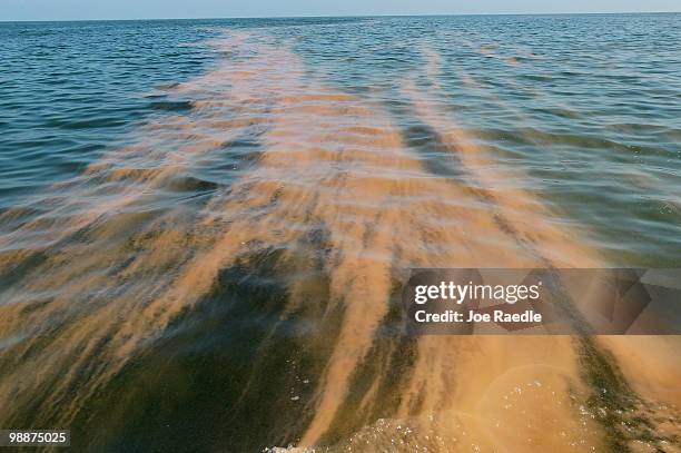 Orange colored chemical dispersant is seen in the water as it is used to help with the massive oil spill on May 5, 2010 in Breton and Chandeleur...