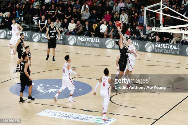 Isaac Fotu of New Zealand competes for a rebound against Abudushalamu Abudurexiti of China during the FIBA World Cup Qualifying match between the New...