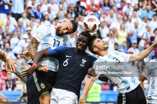 Nicolas Otamendi of Argentina, Paul Pogba of France and Nicolas Tagliafico of Argentina during the FIFA World Cup Round of 16 match between France...