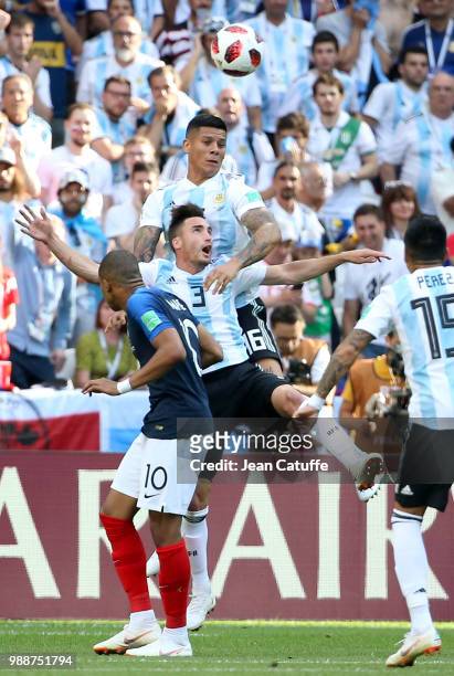 Kylian Mbappe of France, Nicolas Tagliafico, Marcos Rojo of Argentina during the 2018 FIFA World Cup Russia Round of 16 match between France and...