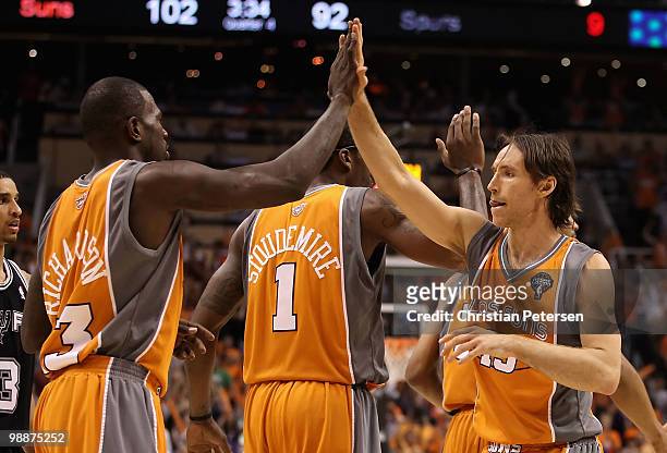 Steve Nash of the Phoenix Suns high-fives teammate Jason Richardson after scoring against the San Antonio Spurs during Game Two of the Western...