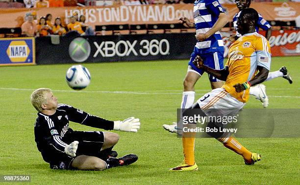 Goalkeeper Kevin Hartman of FC Dallas blocks a shot by Dominic Oduro of the Houston Dynamo at Robertson Stadium on May 5, 2010 in Houston, Texas.