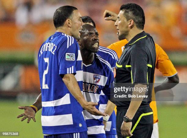 Daniel Hernandez of FC Dallas pleads Jair Benitez's case after he was given a red card ejection by referee Jorge Gonzalez for serious foul play on...