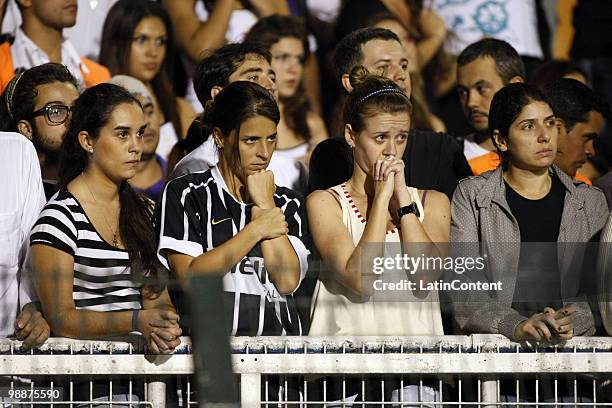 Supporters of Corinthians in lament after losing to Flamengo during a Libertadores Cup match at Pacaembu stadium on May 5, 2010 in Sao Paulo, Brazil.