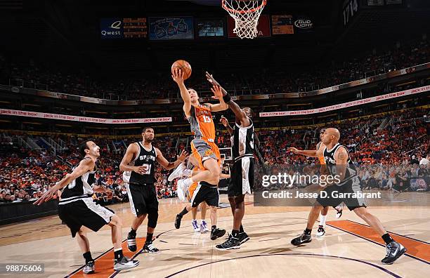 Steve Nash of the Phoenix Suns shoots against Antonio McDyess of the San Antonio Spurs in Game Two of the Western Conference Semifinals during the...