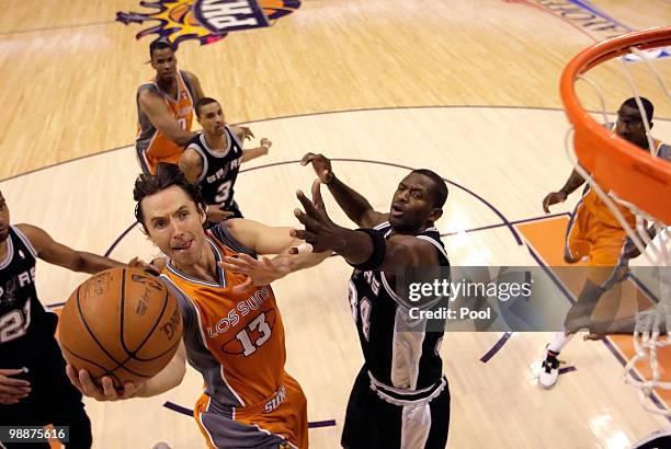 Steve Nash of the Phoenix Suns drives to the basket past Antonio McDyess of the San Antonio Spurs during Game Two of the Western Conference...