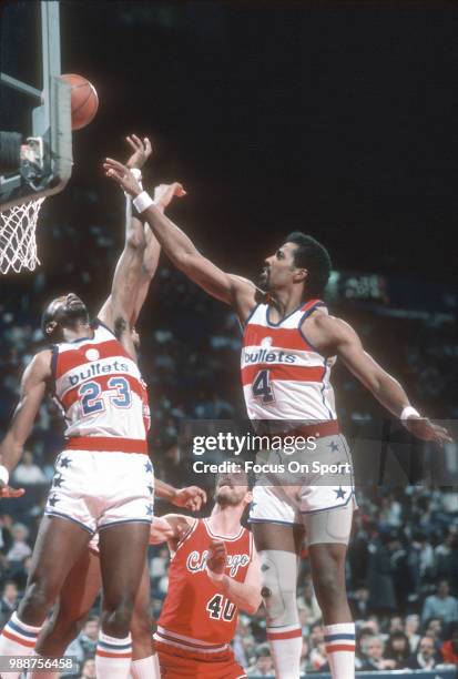 Cliff Robinson and Charles Jones of the Washington Bullets battles for a rebound against the Chicago Bulls during an NBA basketball game circa 1985...