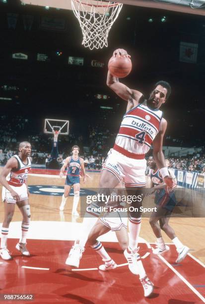 Cliff Robinson of the Washington Bullets grabs a rebound against the Detroit Pistons during an NBA basketball game circa 1986 at the Capital Centre...