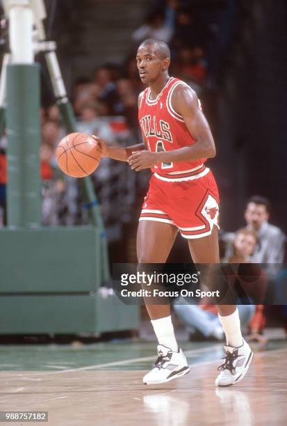 Craig Hodges of the Chicago Bulls dribbles the ball against the Milwaukee Bucks during an NBA basketball game circa 1990 at the Bradley Center in...