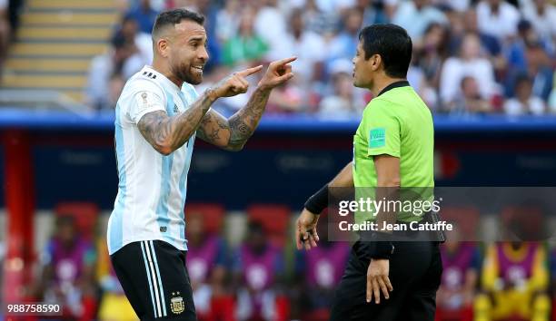 Nicolas Otamendi of Argentina argues with referee Alireza Faghani of Iran during the 2018 FIFA World Cup Russia Round of 16 match between France and...