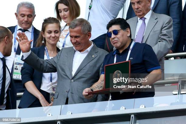 Diego Maradona receives an award from President of Tatarstan region Rustam Minnikhanov before the 2018 FIFA World Cup Russia Round of 16 match...