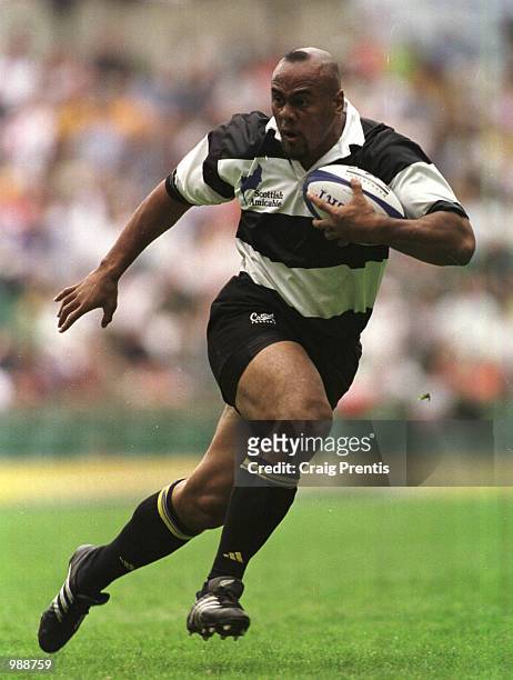 Jonah Lomu of the Barbarians in full flow against England during the match between England and the Barbarians played at Twickenham, London. Mandatory...