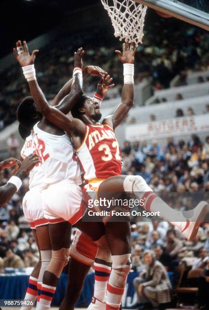 Dan Roundfield of the Atlanta Hawks battles for a rebound against the New Jersey Nets during an NBA basketball game circa 1979 at the Rutgers...