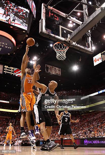 Grant Hill of the Phoenix Suns puts up a shot over Richard Jefferson of the San Antonio Spurs during Game Two of the Western Conference Semifinals of...