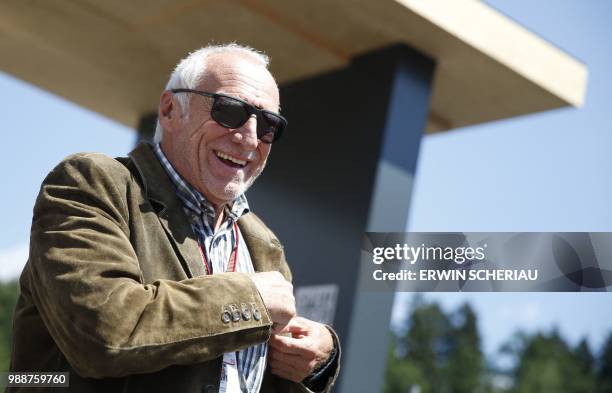 Red Bull CEO Austrian Dietrich Mateschitz arrives in the paddocks ahead of the Austrian Formula One Grand Prix in Spielberg, central Austria, on July...