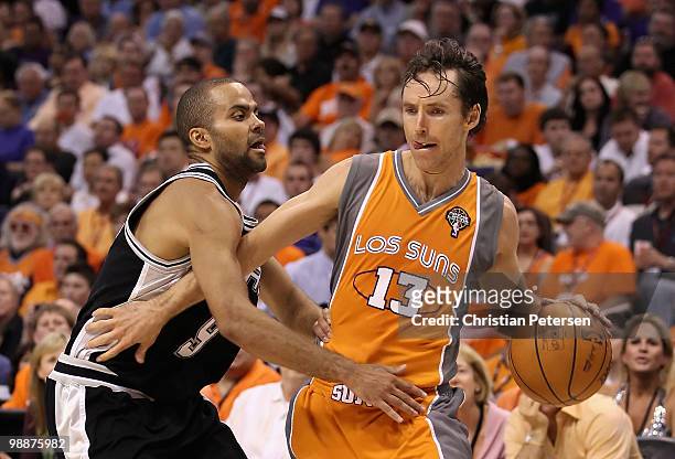 Steve Nash of the Phoenix Suns handles the ball under pressure from Tony Parker of the San Antonio Spurs during Game Two of the Western Conference...