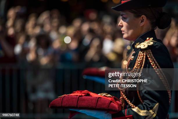 French Republican guard carry the Grand-croix de la Legion d'honneur and the Legion d'honneur on a cushion belonging to French politician and...