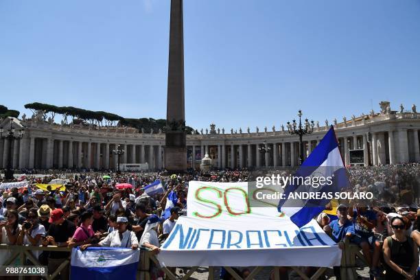 Faithful from Nicaragua attend the Sunday Angelus prayer of Pope Francis in St Peter's square on July 1, 2018 in Vatican.