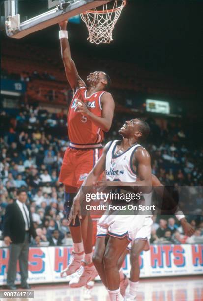 Danny Manning of the Los Angeles Clippers shoots over Bernard King of the Washington Bullets during an NBA basketball game circa 1991 at the Capital...