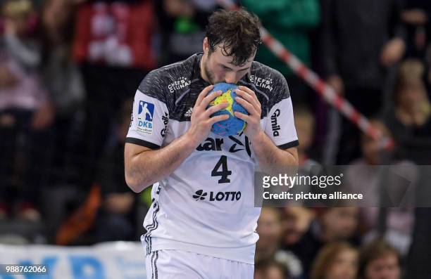 Kiel's Domagoj Duvnjak kissing the ball out of joy during the German Bundesliga handball match between SG Flensburg-Handewitt and THW Kiel in the...
