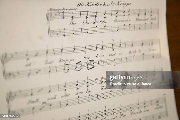 Score of the Christmas song "Ihr Kinderlein kommet" by Christoph von Schmid in a display case at the exhibition "Christoph von Schmid und seine Welt"...