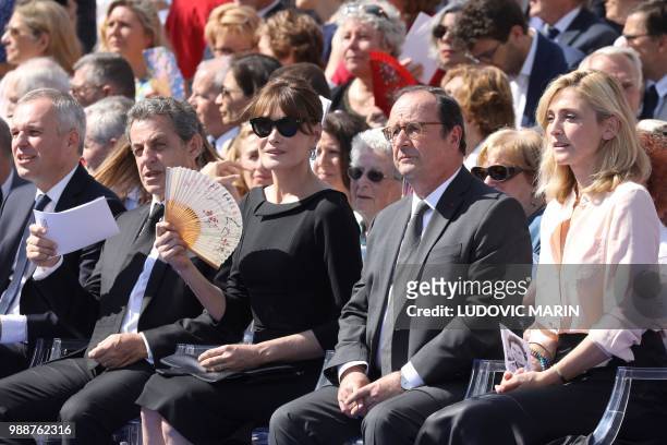 The President of the French National Assembly Francois de Rugy, former French President Nicolas Sarkozy, his wife musician Carla Bruni, former French...