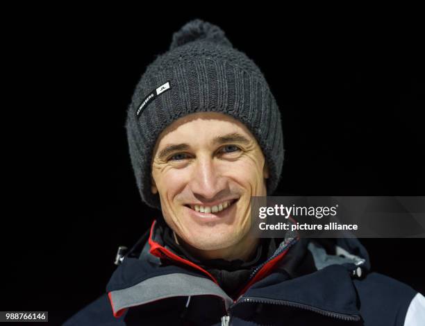 Former Olympic champion Martin Schmitt laughs after the ski jumping at the FIS Ski Jumping World Cup at the Hochfirstschanze in Titisee-Neustadt,...