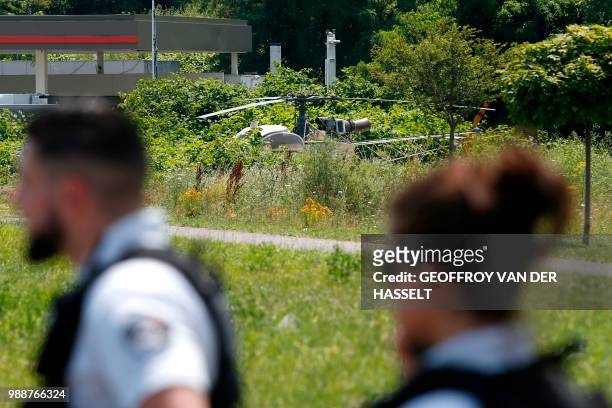 This picture taken on July 1, 2018 in Gonesse, north of Paris shows a French helicopter Alouette II abandoned by French armed robber Redoine Faid...