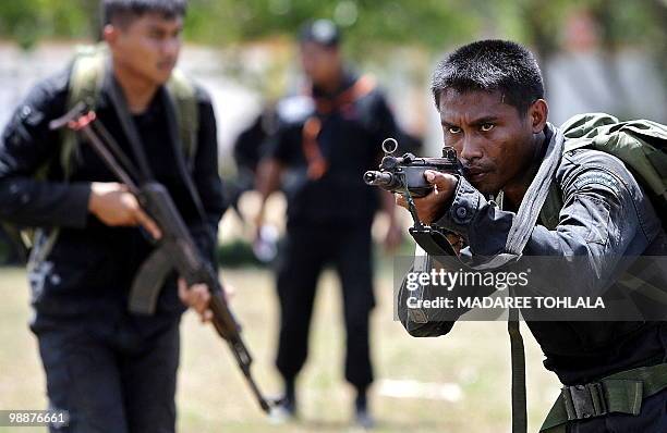 Newly-recruited Thai Rangers take part in a training session at a military camp in Thailand's restive southern province of Narathiwat on May 6, 2010....