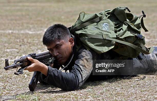 Newly-recruited Thai Rangers take part in a training session at a military camp in Thailand's restive southern province of Narathiwat on May 6, 2010....