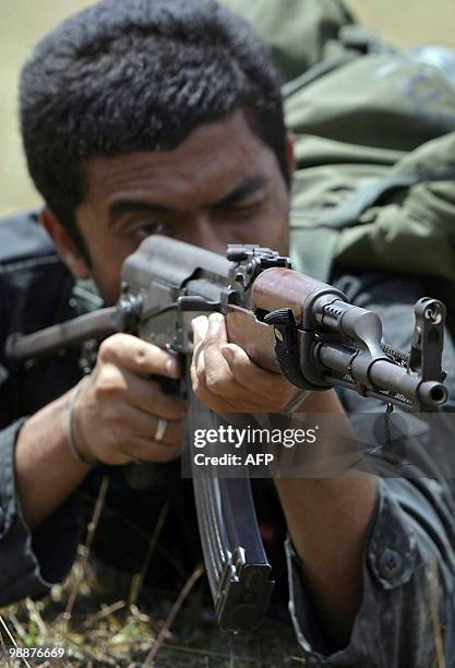 Newly-recruited Thai Rangers take part in a training session at a military camp in Thailand's restive southern province of Narathiwat on May 6, 2010....