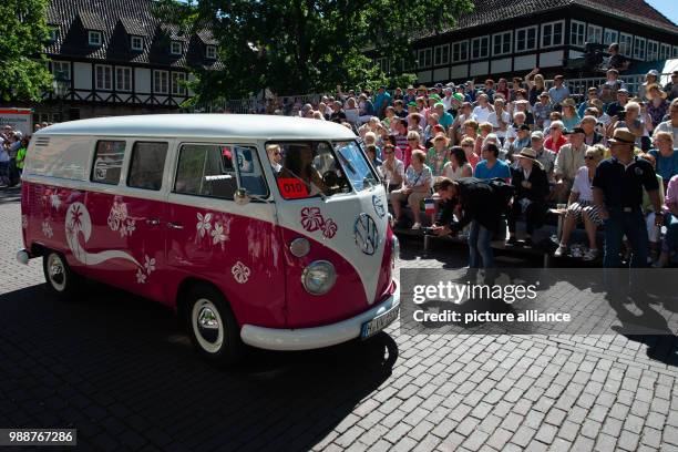 July 2018, Germany, Hanover: An old Volkswagen Bulli rolls up during the parade of the Marksmen's Festival, which runs from 29 June to 08 July. At...