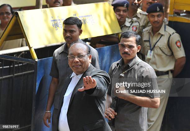 Defence Lawyer of the suspected lone surviving gunman of the 2008 Mumbai attacks Mohammad Ajmal Kasab, K.P. Pawar gestures as he arrives outside the...