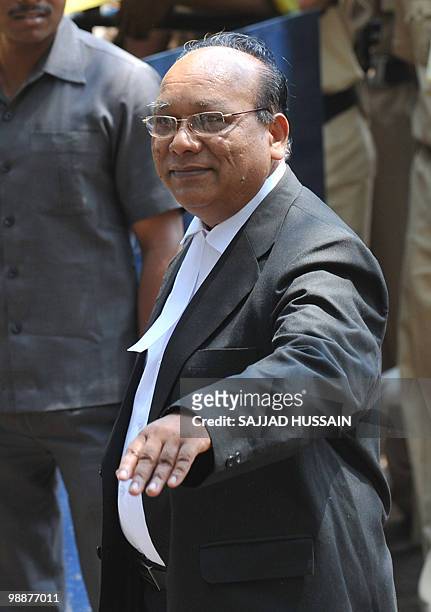 Defence Lawyer of the suspected lone surviving gunman of the 2008 Mumbai attacks Mohammad Ajmal Kasab, K.P. Pawar gestures as he arrives outside the...