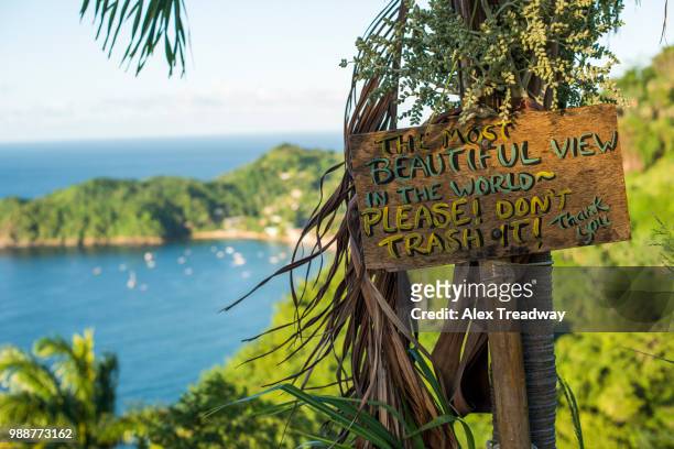 a sign asking readers not to trash the most beautiful view in the world at castara bay in tobago, trinidad and tobago, west indies, caribbean, central america - 354 stock-fotos und bilder